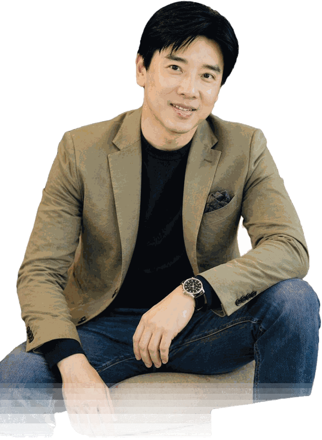 Dato' Seri Ivan Teh seated in a navy knit sweater, looking to one side